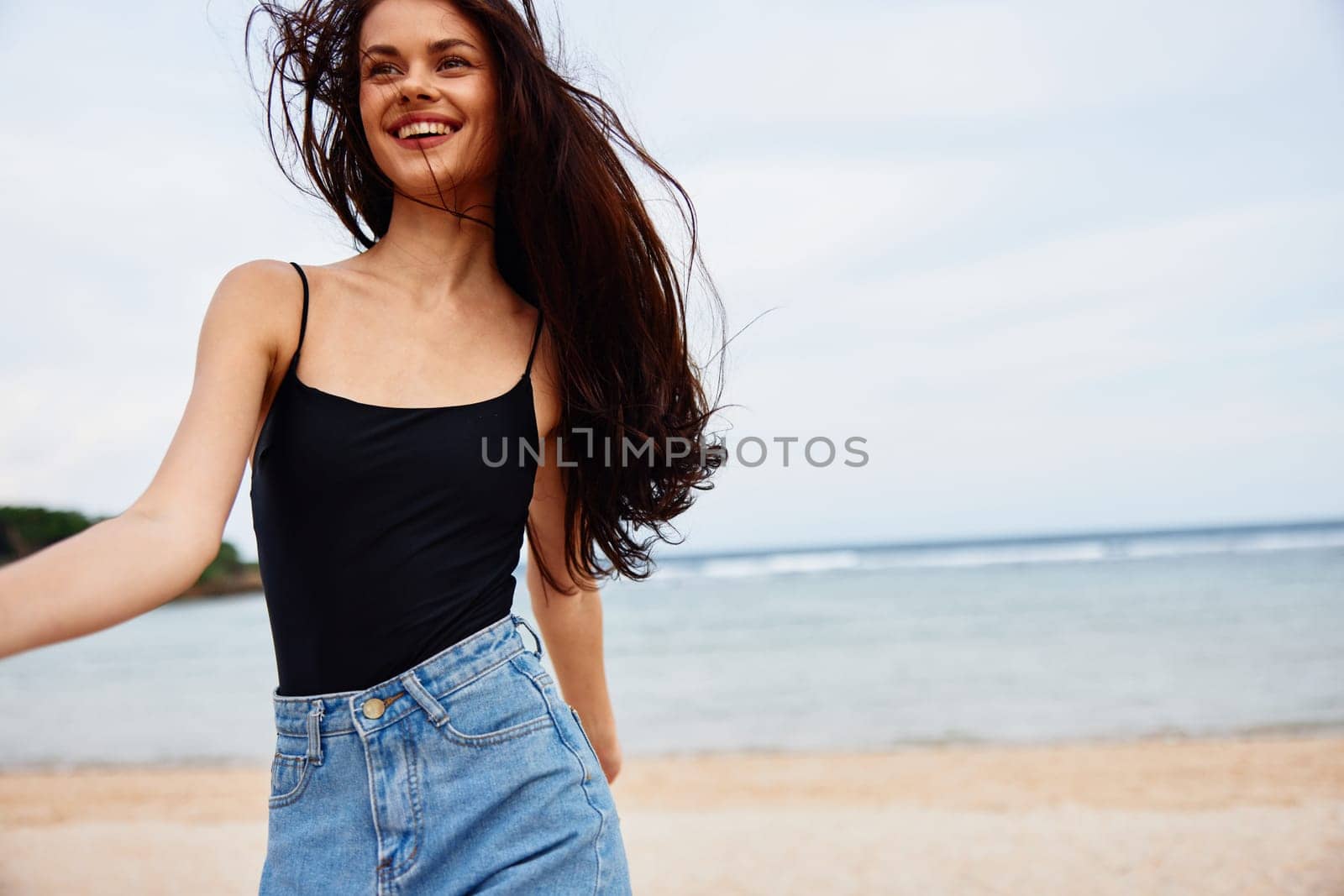 sunset woman sea wave lifestyle carefree sexy smile young travel summer flight leisure smiling sand running beach person relax female freedom