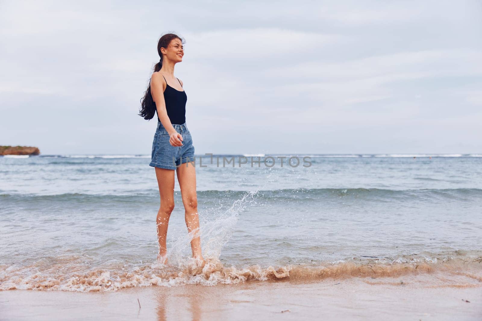 female woman lifestyle girl carefree sea beach long sand wave smile travel hair hair relax young sunrise sunset running nature summer freedom