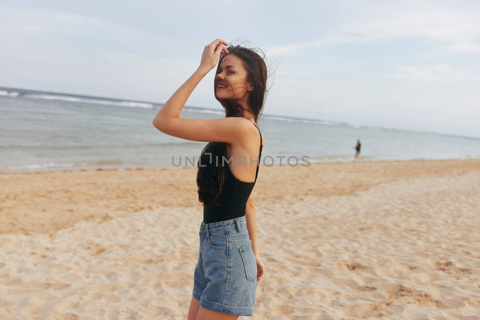 leisure woman female person vacation sky water lifestyle sand shore sunset happiness holiday beach smile ocean tropical summer enjoyment long hair sea