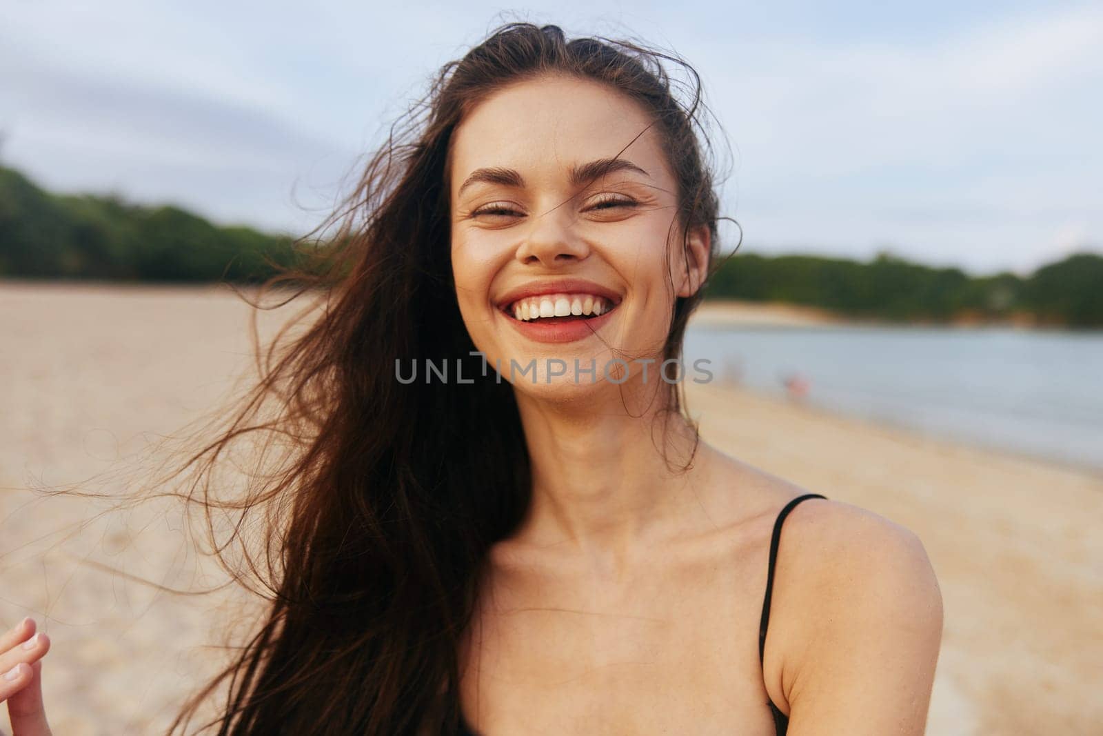 woman adult tropical holiday sand person lifestyle smile coast summer ocean enjoyment beach sunset girl beautiful vacation carefree walk beauty sea