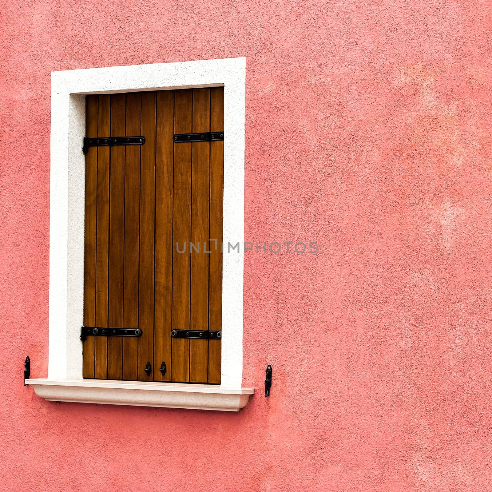 Window of one of the characteristic colored houses of Burano (Venice)