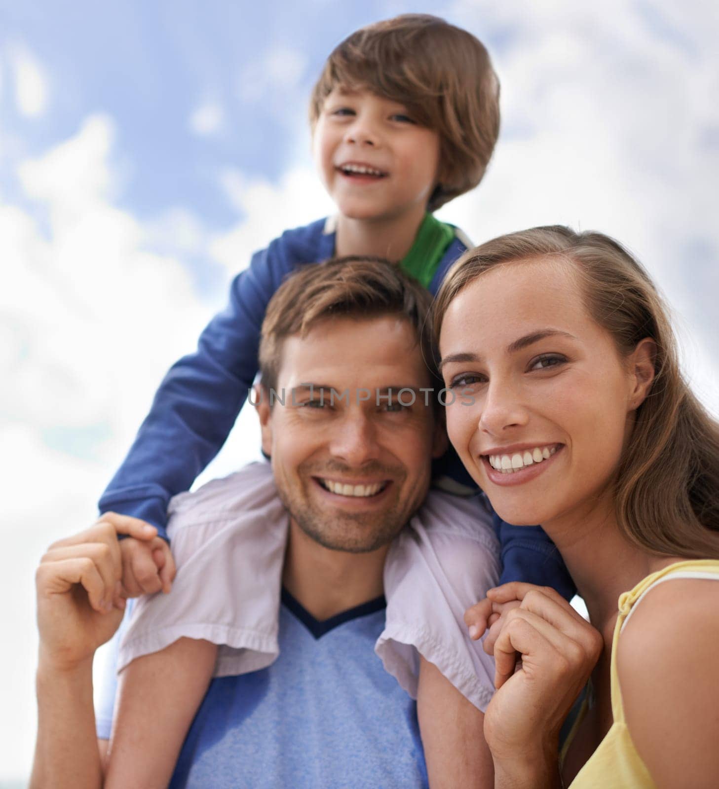 Family, sky and smile portrait outdoor while happy for travel, fun or holiday in summer. Face of man, woman and child or son together on vacation or adventure in nature with happiness, love and care.