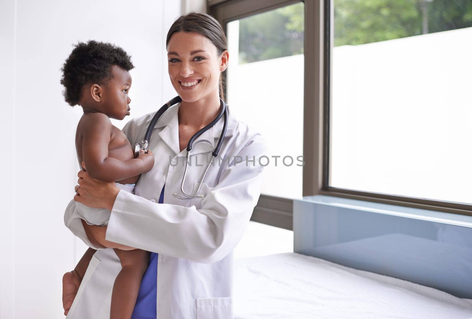 Healthcare, portrait and baby with woman doctor at hospital for heart, lungs and chest exam. Medical, consultation and lady pediatrician with stethoscope for toddler development, health and heartbeat.