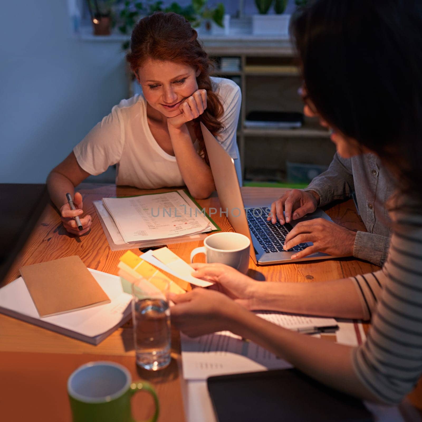 Collaboration, dark and a business team working in the boardroom for planning, strategy or innovation. Meeting, teamwork and overtime with a group of employees at work together for design at night.