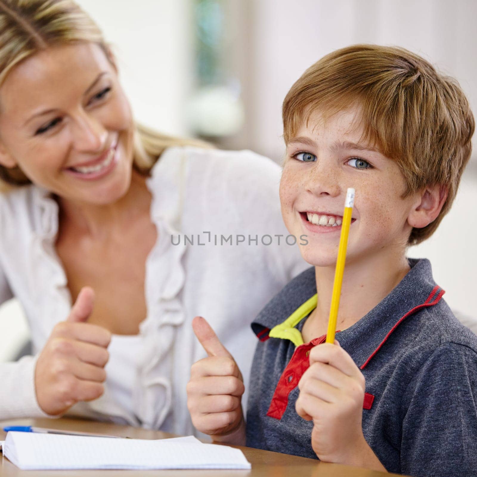 Portrait, kid and teacher with thumbs up in classroom, smile and pencil. Happiness, educator and student with hand gesture for like emoji, agreement and learning in elementary school for education