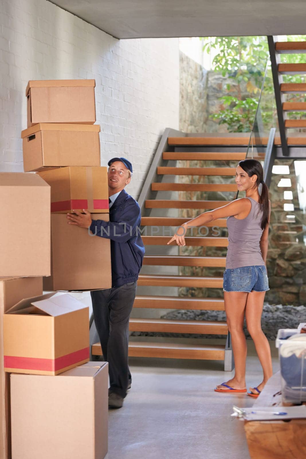 Smile, young woman and receiving delivery from postman for logistics at home or showing parcel for client. Freight, box and lady at her house for package or cargo from a courier and shipping company.