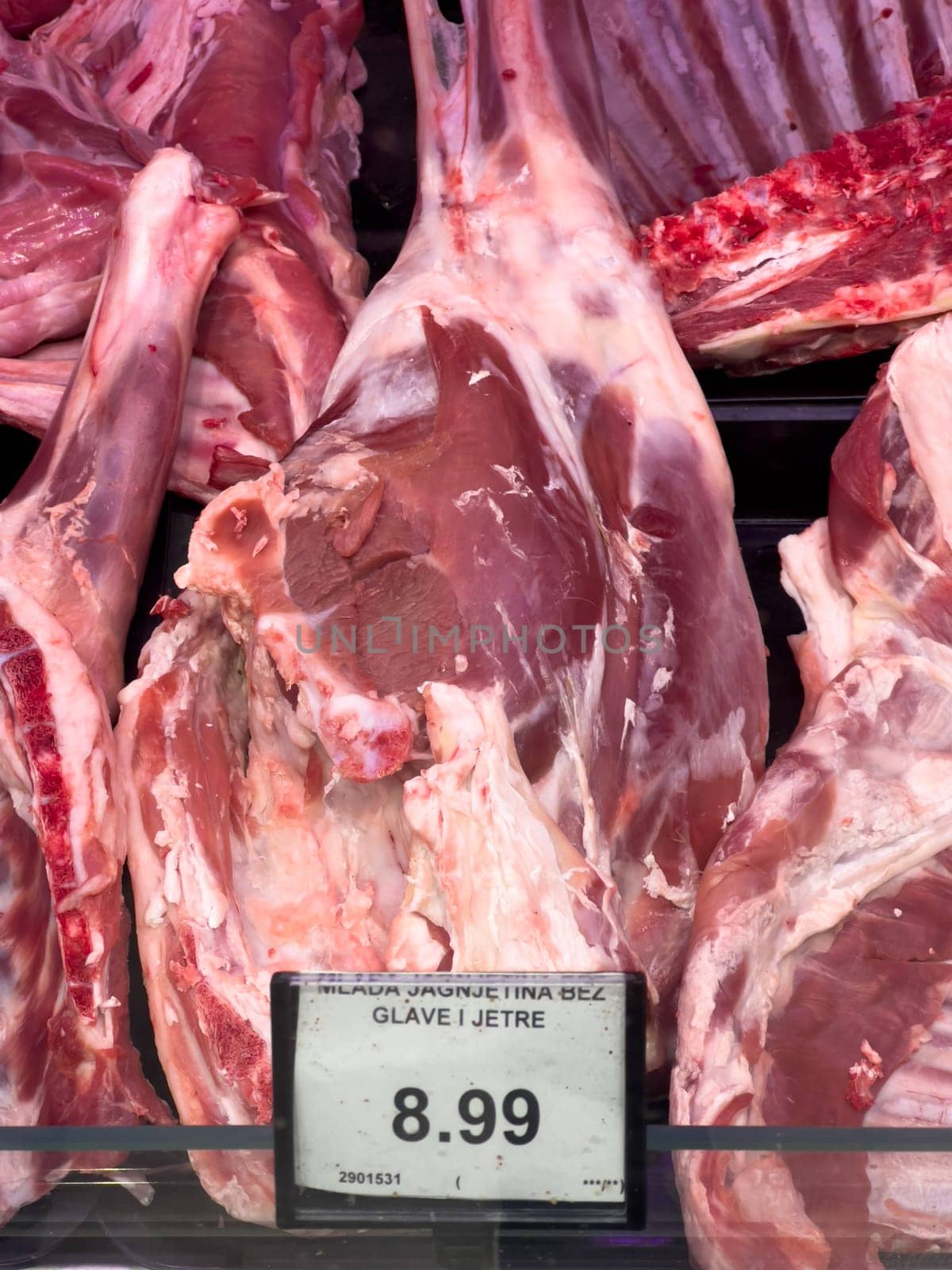 Raw lamb meat on the ribs lies in the supermarket. High quality photo