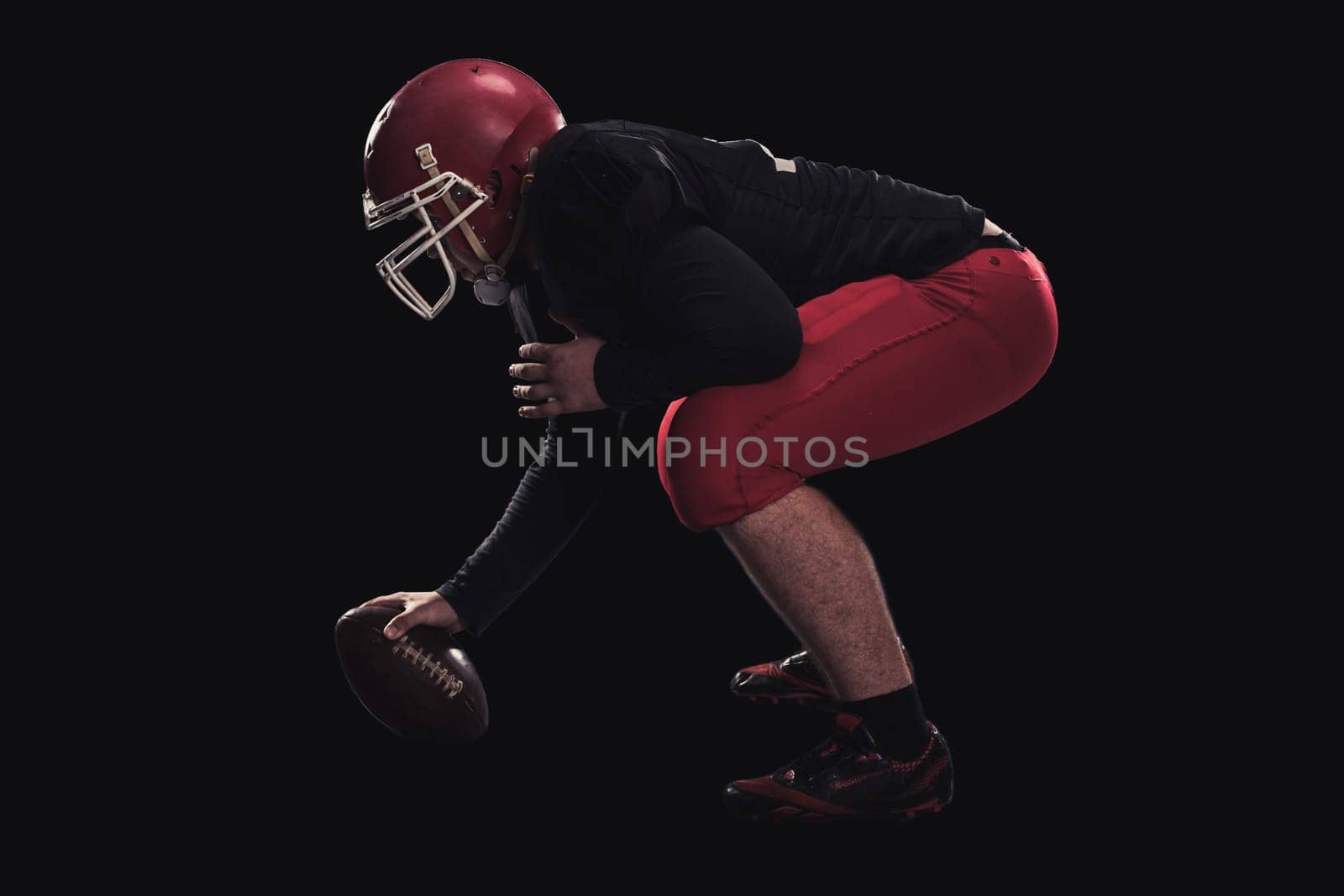 Soccer player on a dark background in vintage style. The classic American game. college Students. player game first before the attack
