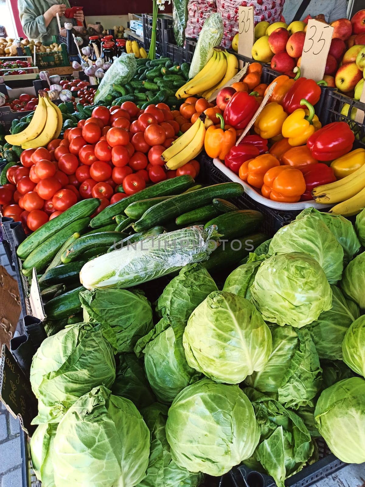 Still life. Food background with colorful organic fruits and vegetable on shelf in local farmer market. Agribusiness by artgf
