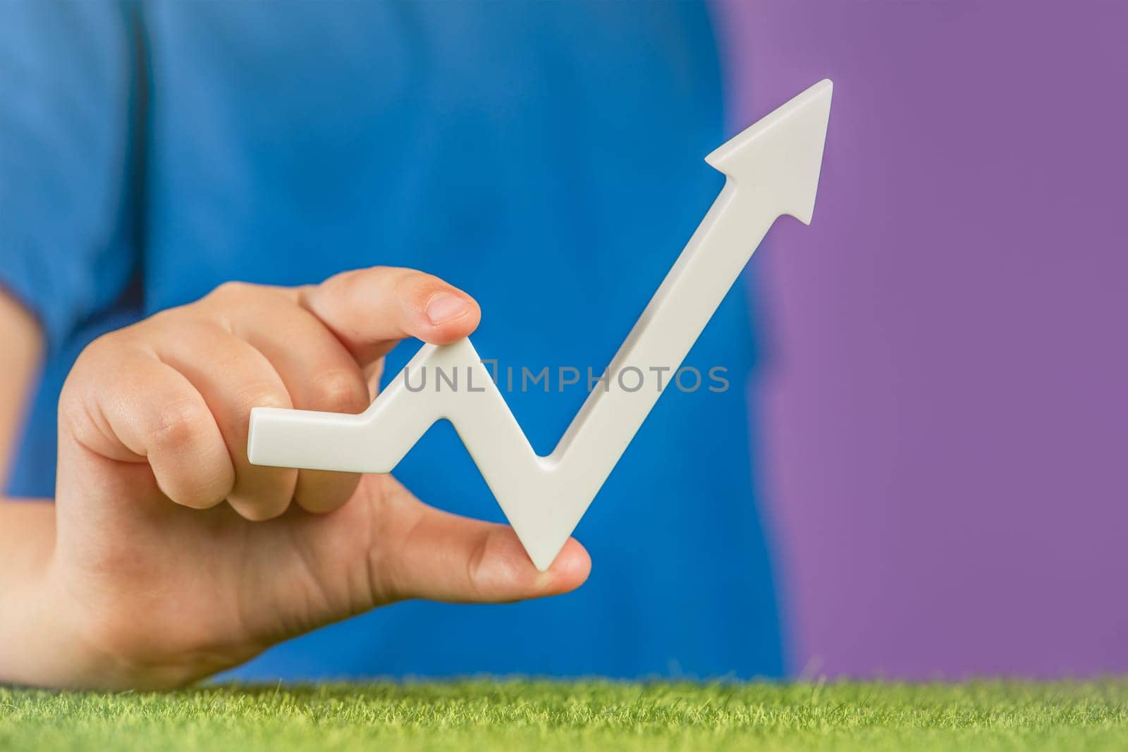 Economic recovery. Wage growth. Raising prices and interest rates. Population growth or any other increase. Banner with a graph arrow in hands on a purple background points up. High quality photo