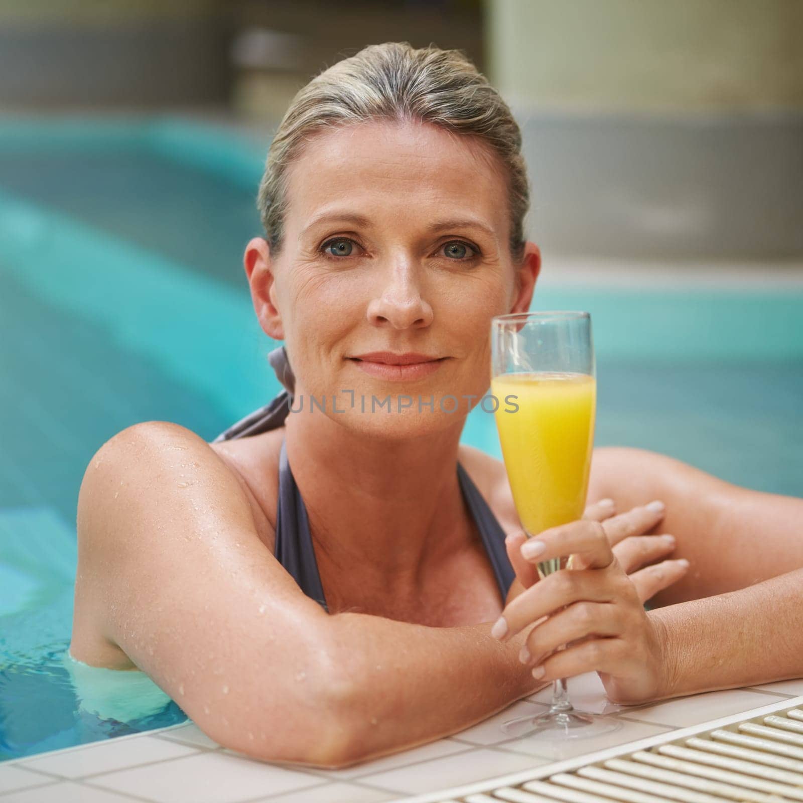 Swimming pool, relax and portrait of woman with juice on holiday, summer vacation and weekend. Travel, luxury spa resort and happy female person with orange drink for happiness, relaxing and peace.