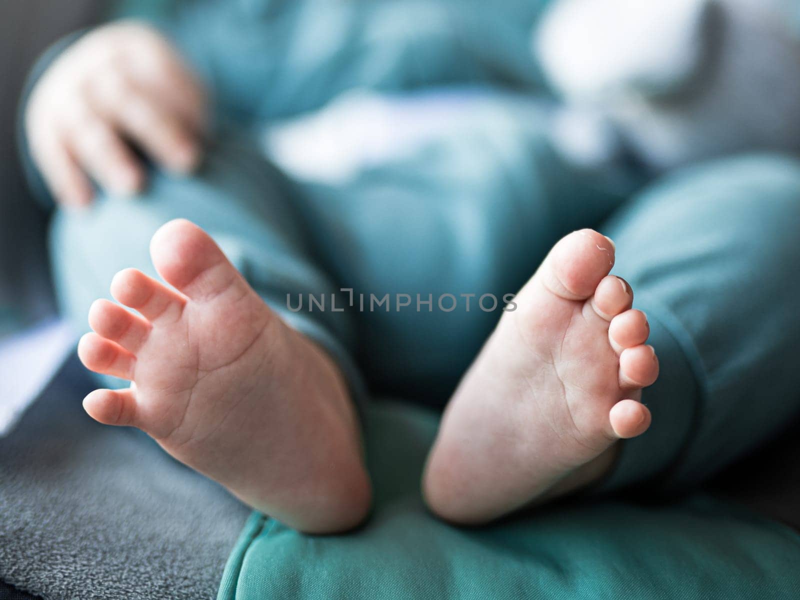 Close-up of cute little baby feet, innocence concept