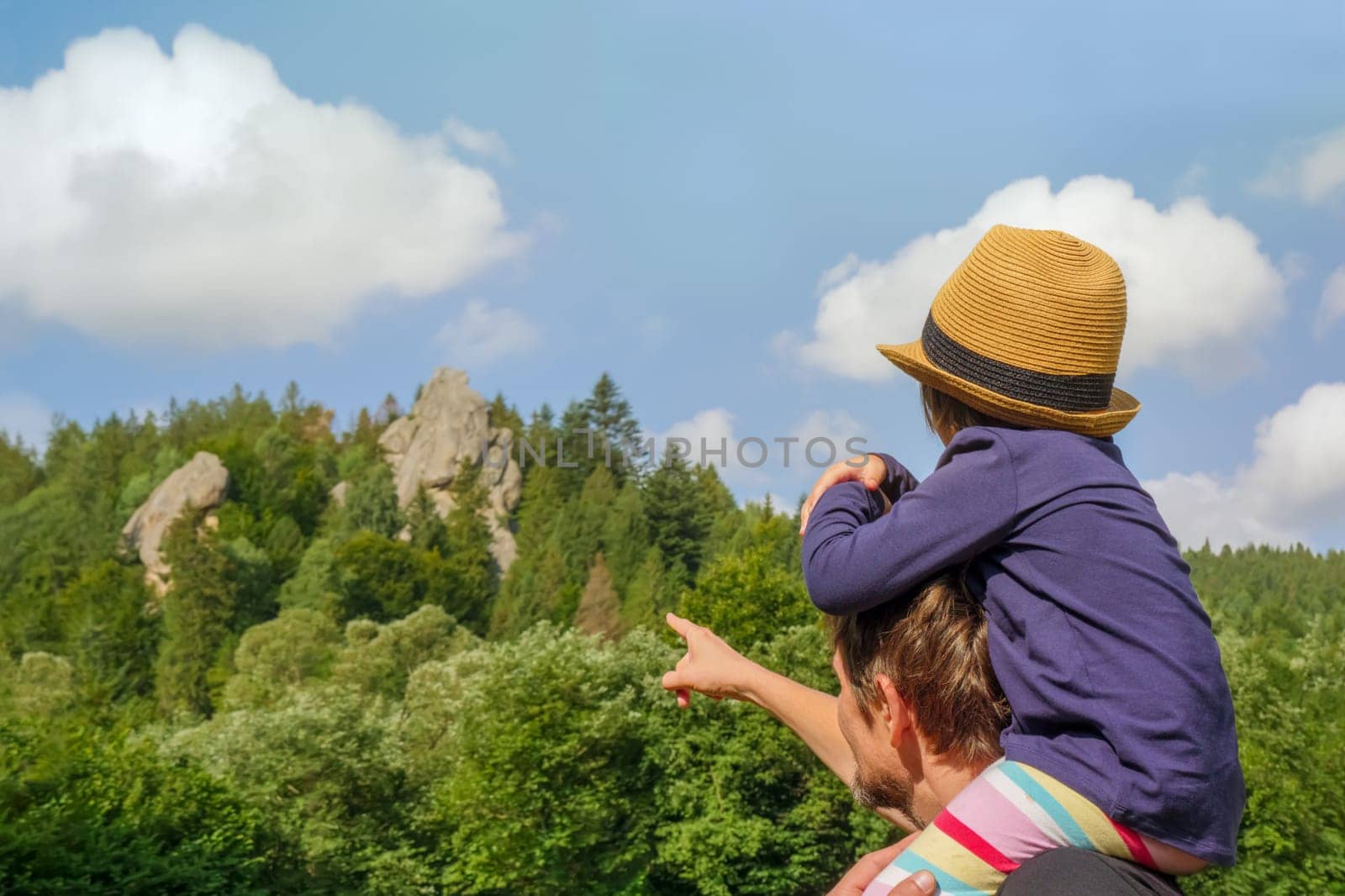 Nature kid on shoulders dad walking hiking adventure kid dad shoulder ride. Nature child on shoulders father walking nature hiking children mountain kid hiking forest walk child adventure forest park by synel