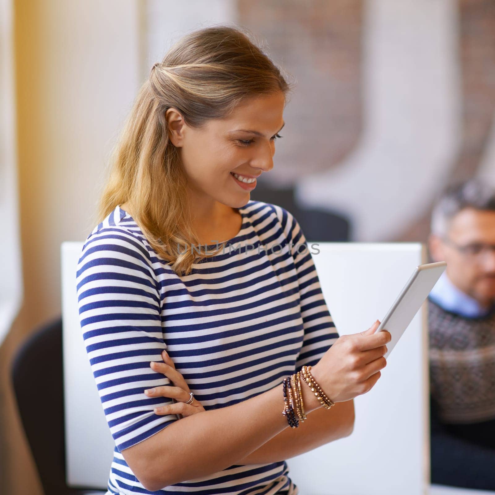 Making contacts online. a young businesswoman using a digital tablet in the office