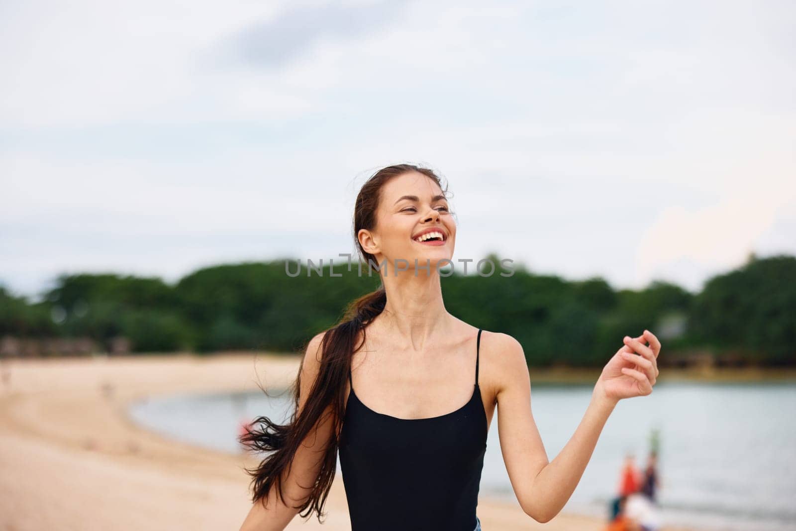 woman running young smile active lifestyle travel sea beach sunset summer by SHOTPRIME