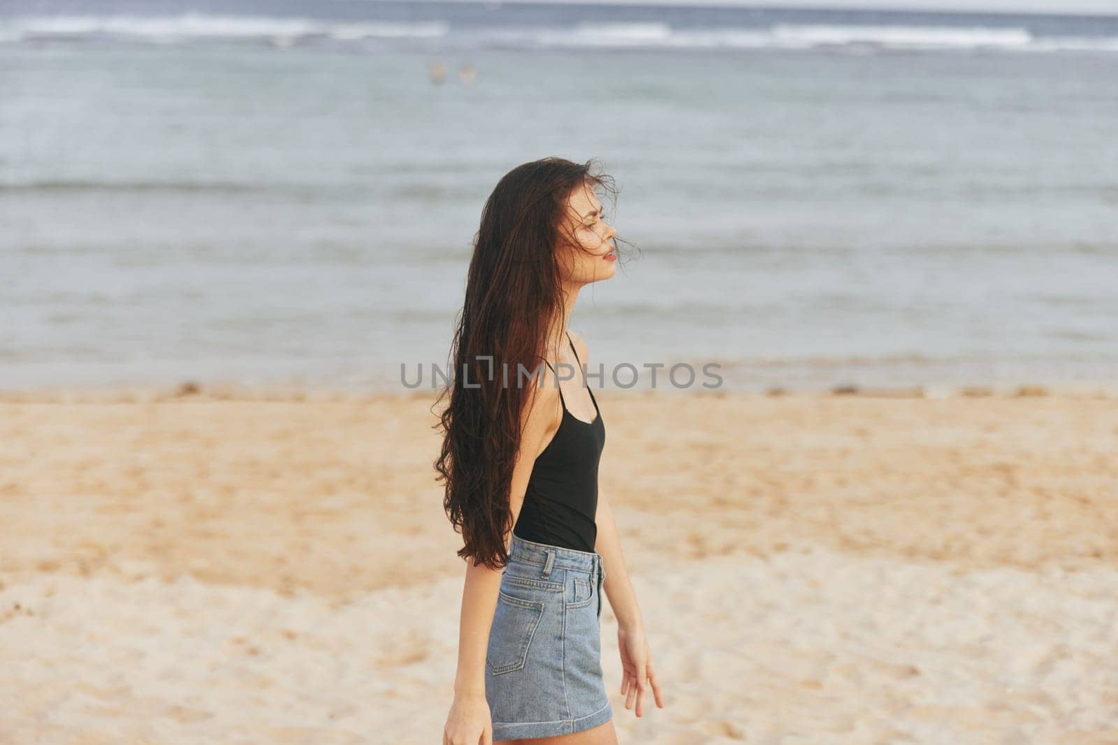 smile woman lifestyle peaceful vacation holiday beach smiling ocean summer sea caucasian long sun relax sunset sunlight sand hair beauty carefree shore