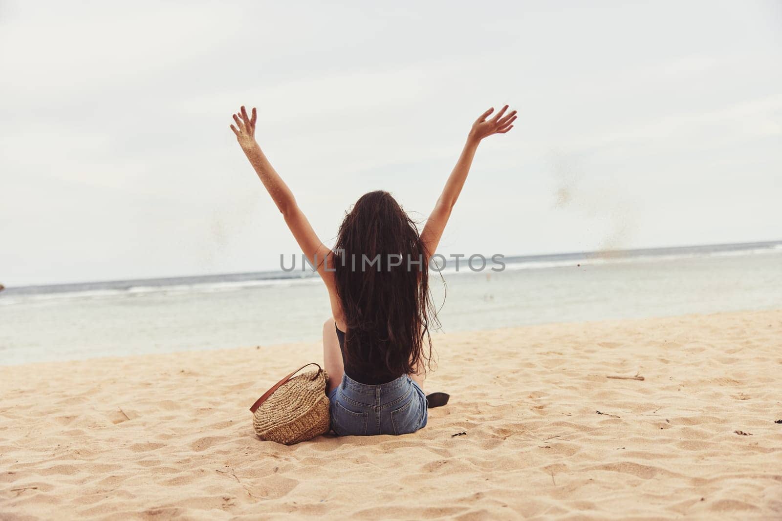 woman travel nature coast sitting smile beach sand freedom sea vacation by SHOTPRIME