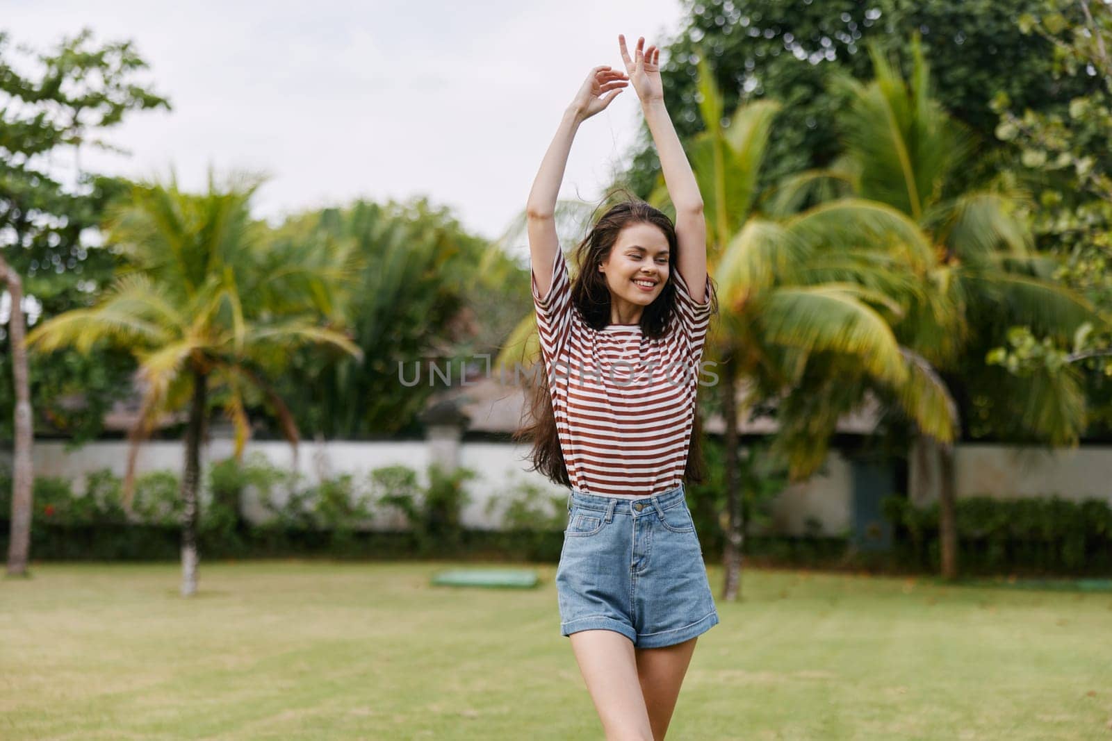 woman black enjoy striped person walk exercise outdoor freedom nature lifestyle fashion t-shirt park summer smiling beautiful young day smile meadow