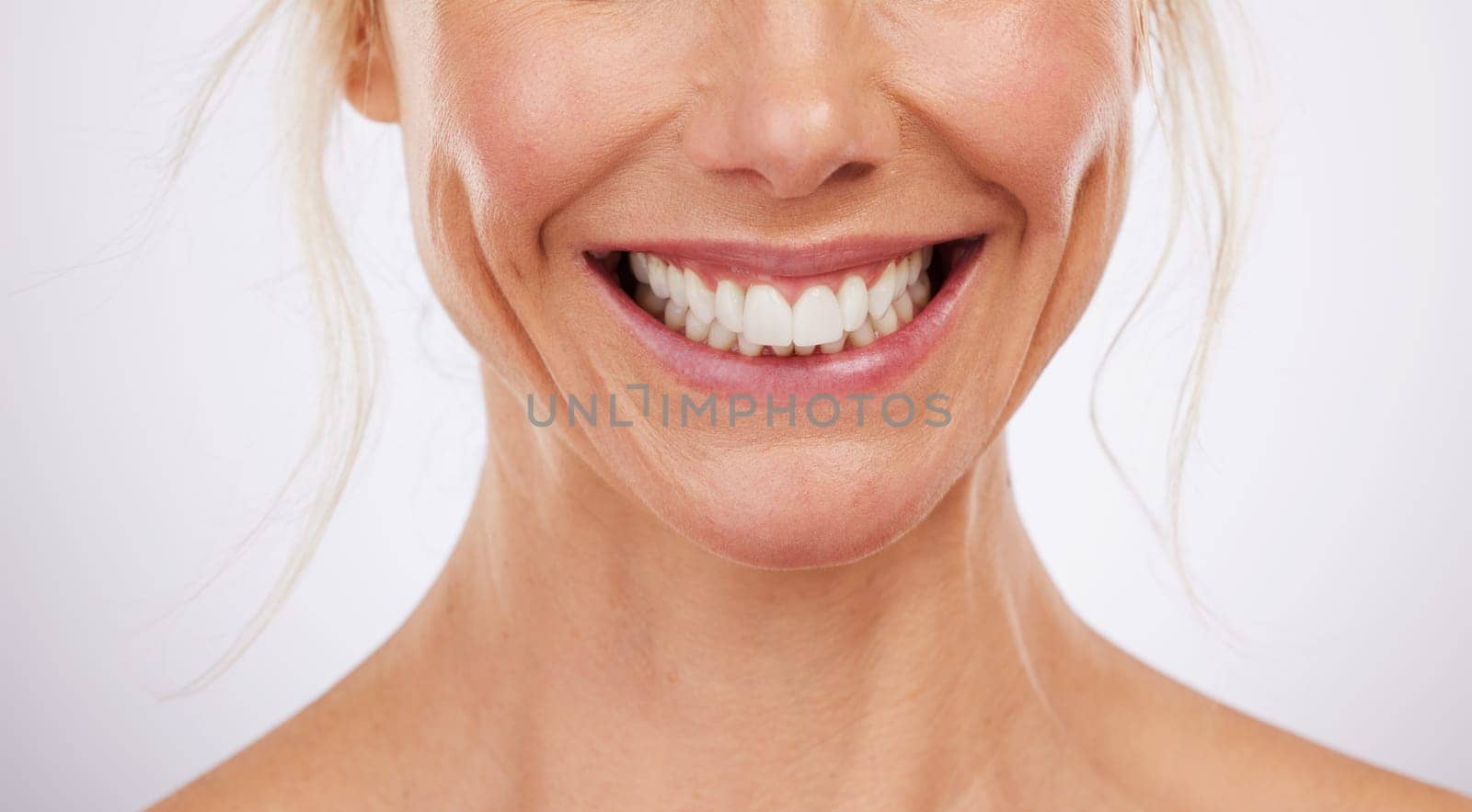 Teeth whitening, mouth and smile of woman in studio, beauty background and fresh mint breath. Closeup female model, clean dental and happy face of skincare wellness, tooth implant and aesthetic salon by YuriArcurs