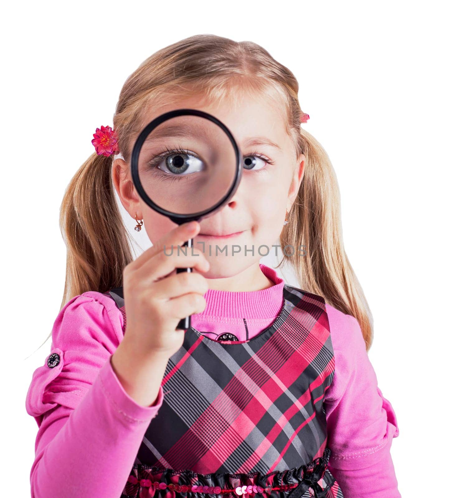 The concept of eye disease and education. An inquisitive child. A beautiful little girl looks into a magnifying glass. The eye is enlarged by aprilphoto