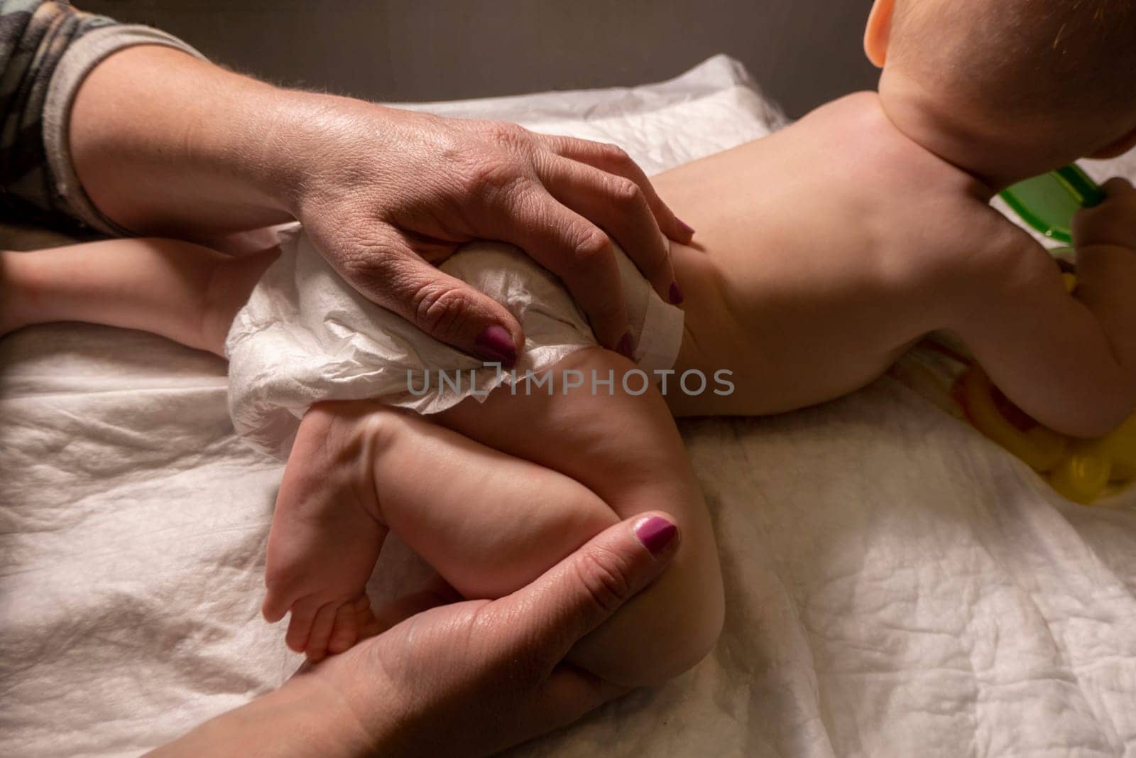 Masseur massaging little baby by kajasja