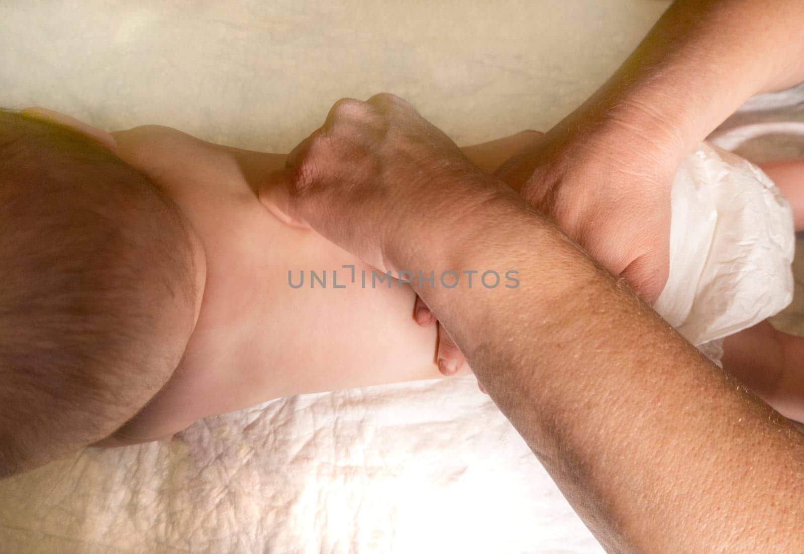 Masseur massaging little baby by kajasja