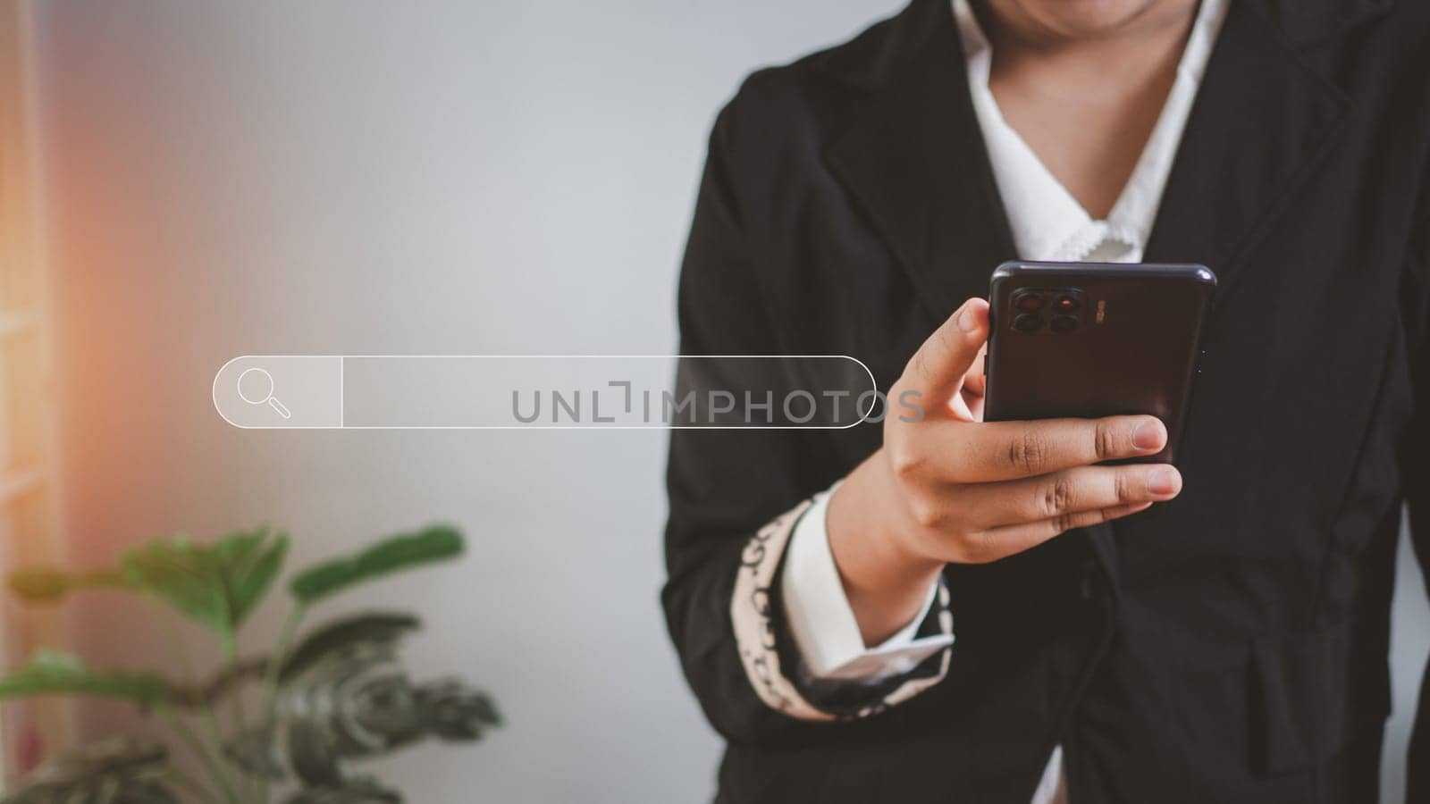 The concept of searching for information from the telephone network. Business woman standing and holding the phone with a search icon.