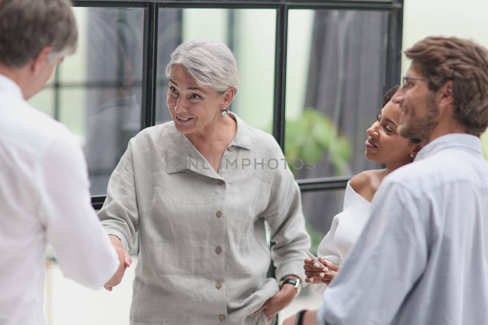 Conversation between managers and employees in the office.