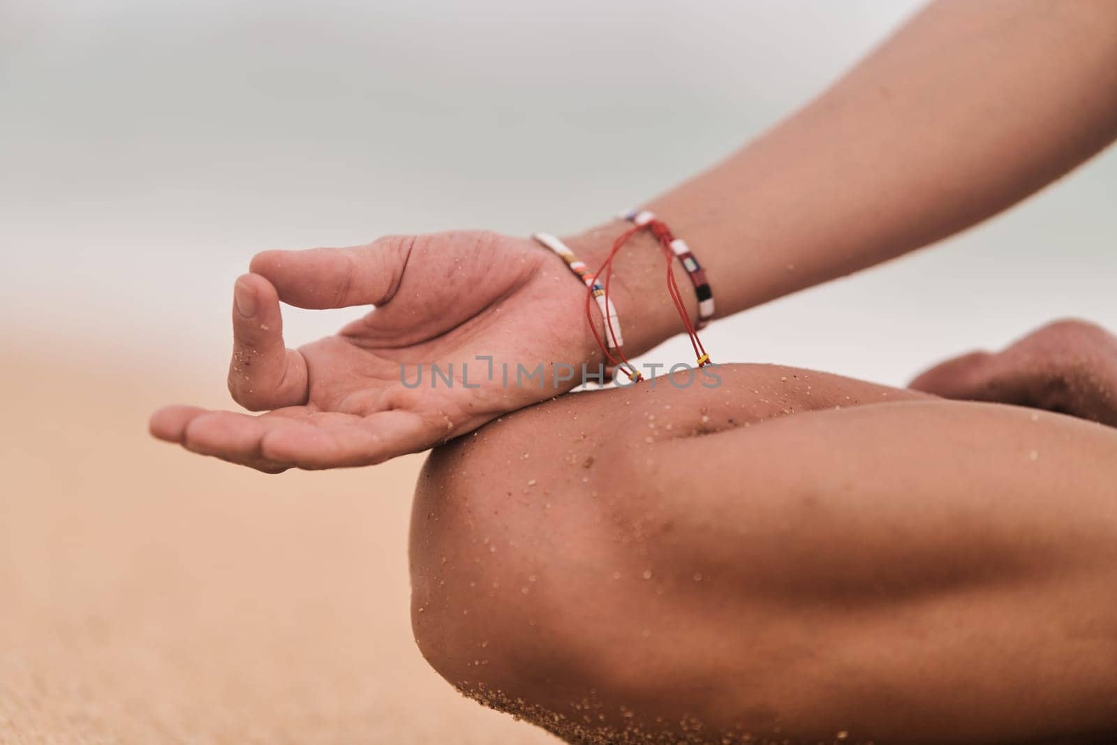 Beautiful girl doing yoga at the beach. High quality photo