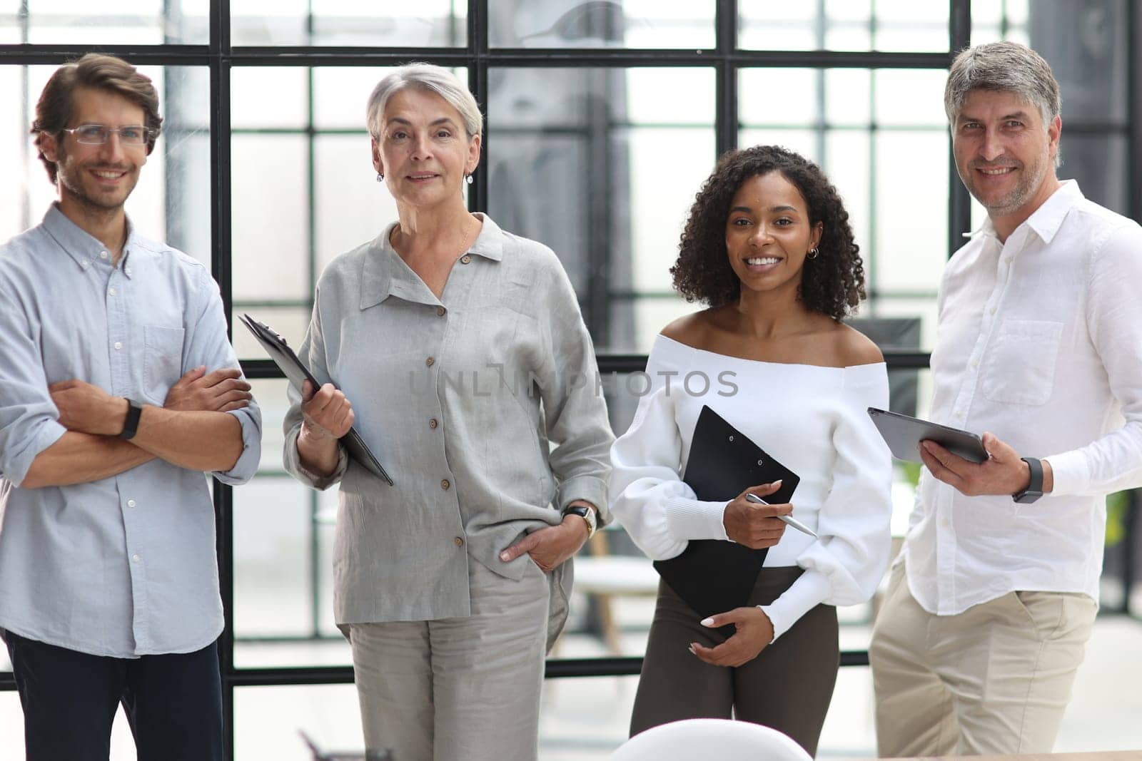 A group of young modern people in smart casual clothes