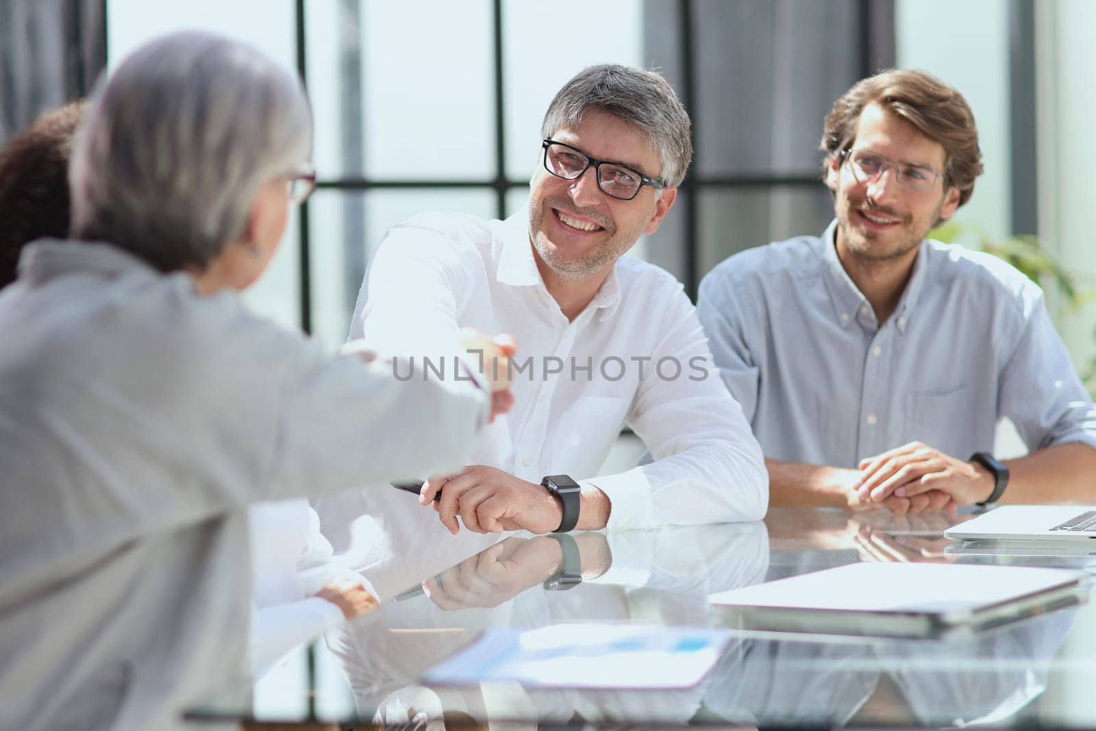 discussion of business people in the office sitting at the table