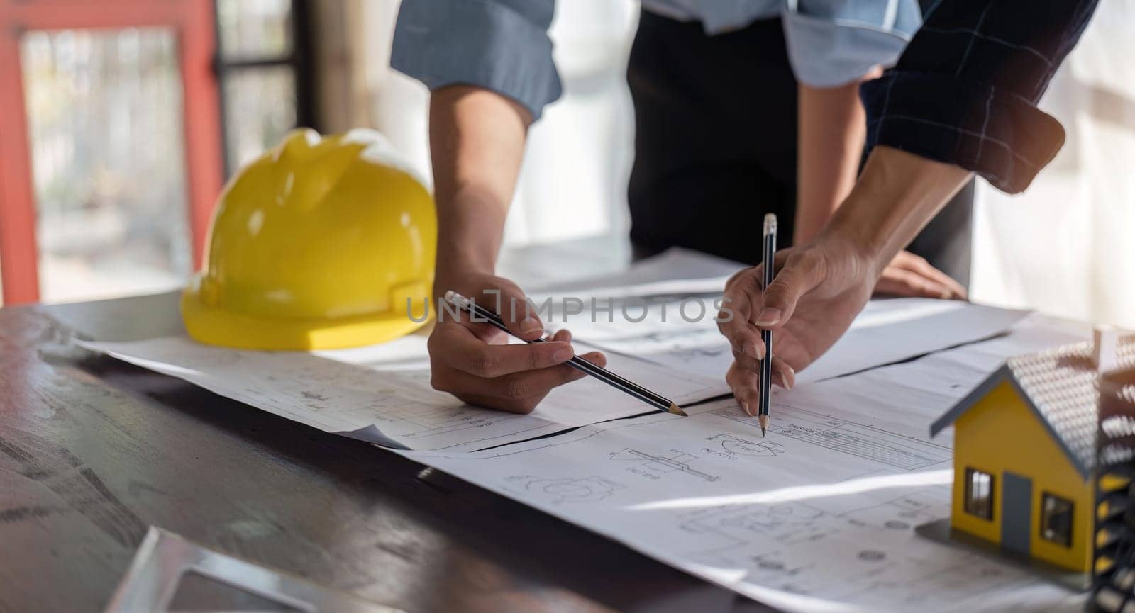 engineer team planning design house, modifying plan, creating construction project and addition according to customer requirement.