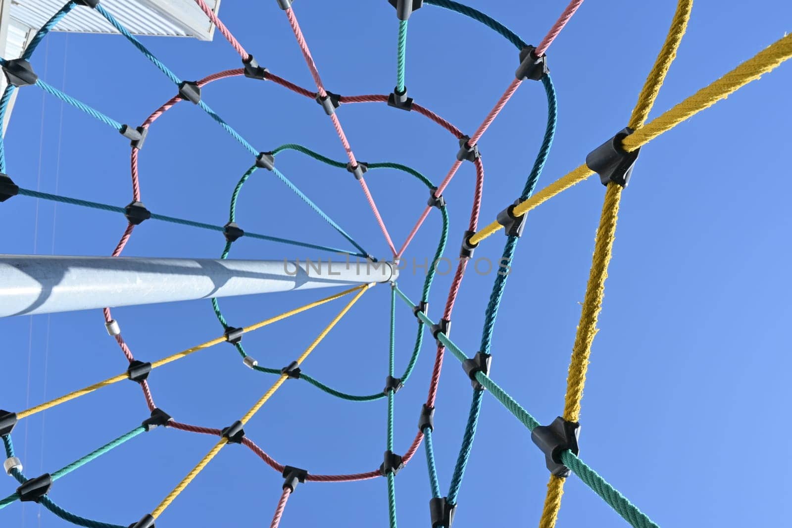 climbing net in children's playground , red rope Childrens playground in the city park. , . High quality photo by jcdiazhidalgo