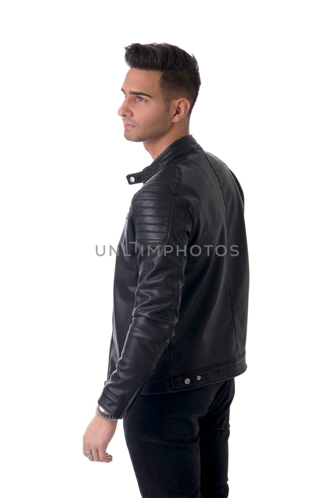 Young handsome man standing in studio shot by artofphoto