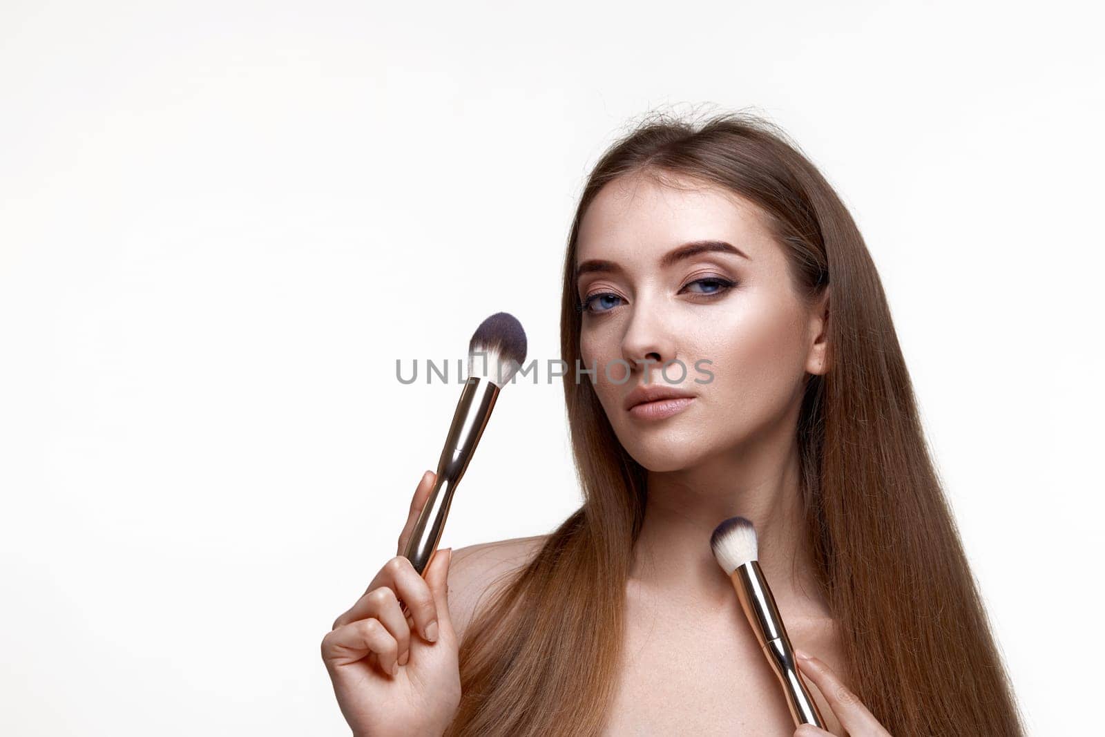 attractive woman with make-up brush for powder isolated on white background