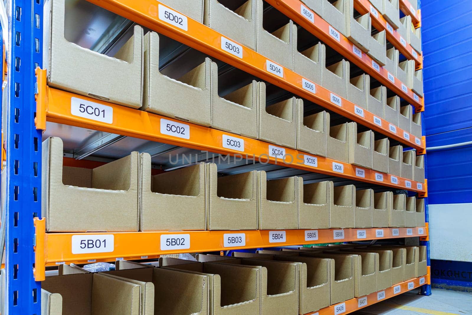 Boxes on racks in a warehouse of goods close-up. High quality photo