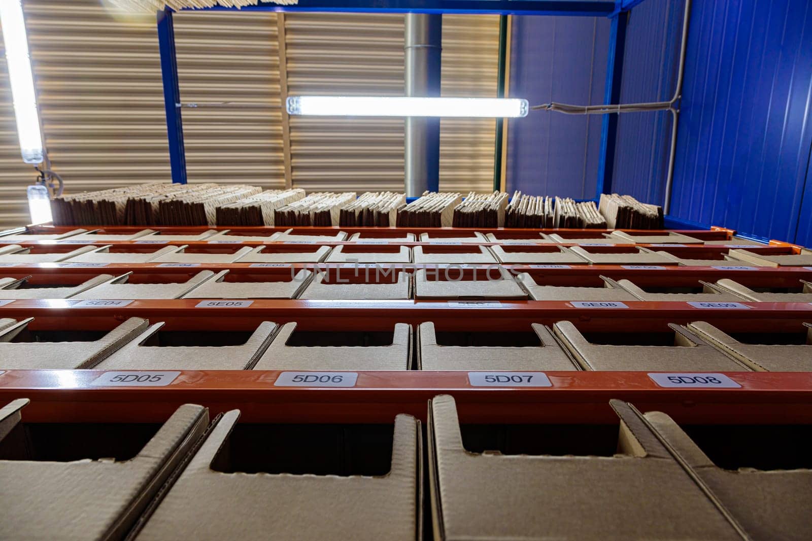 Boxes on racks in a warehouse of goods close-up. High quality photo
