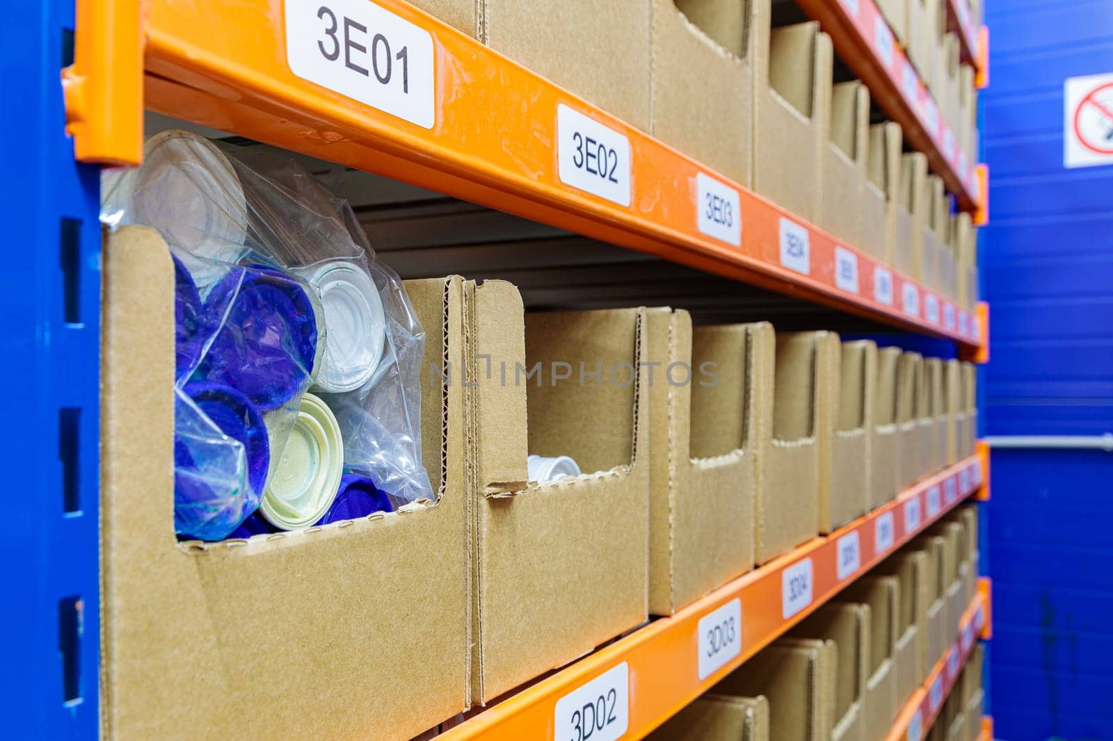Boxes on racks in a warehouse of goods close-up. High quality photo
