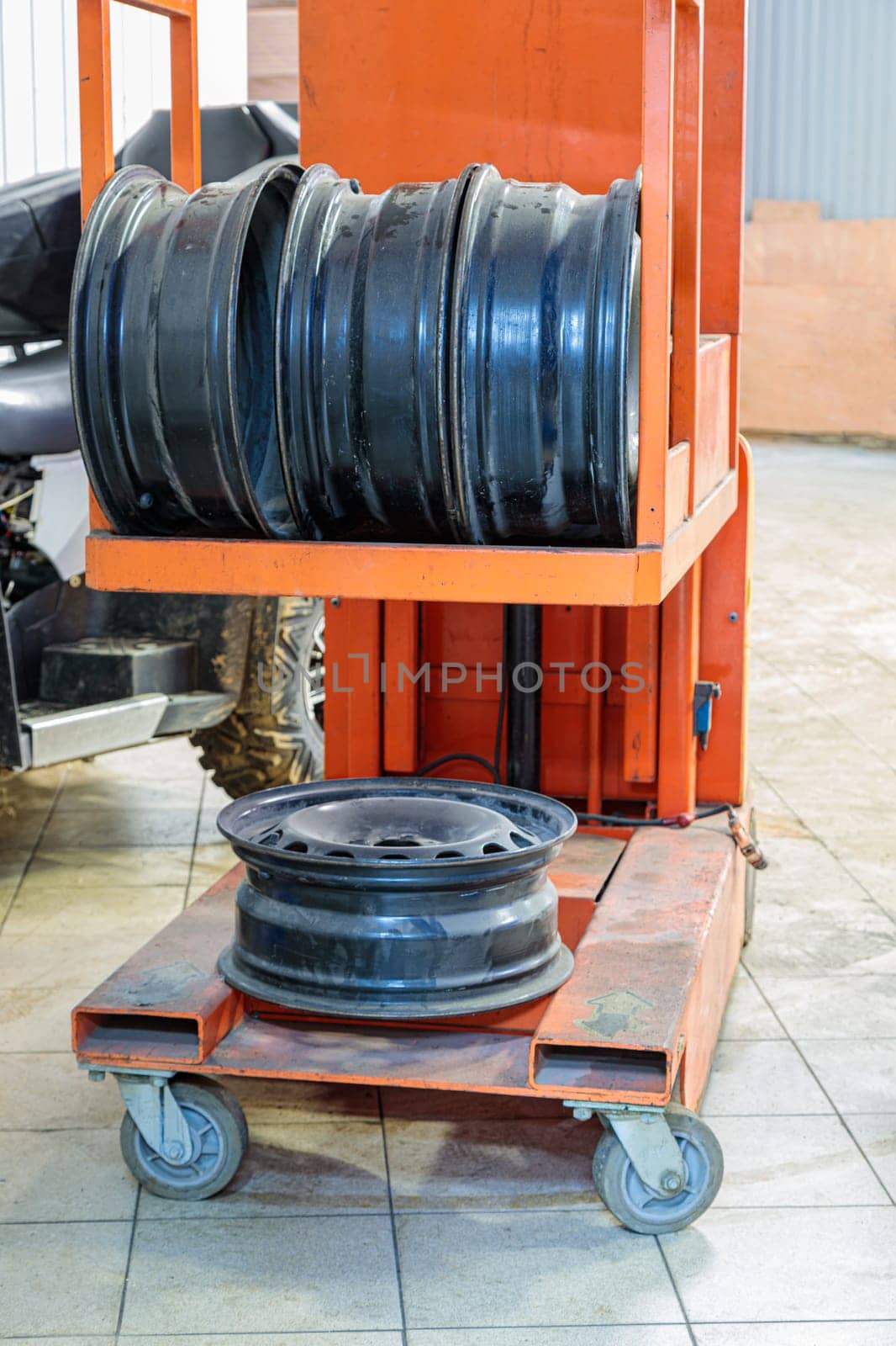 Metal discs for car wheels in a trolley. High quality photo