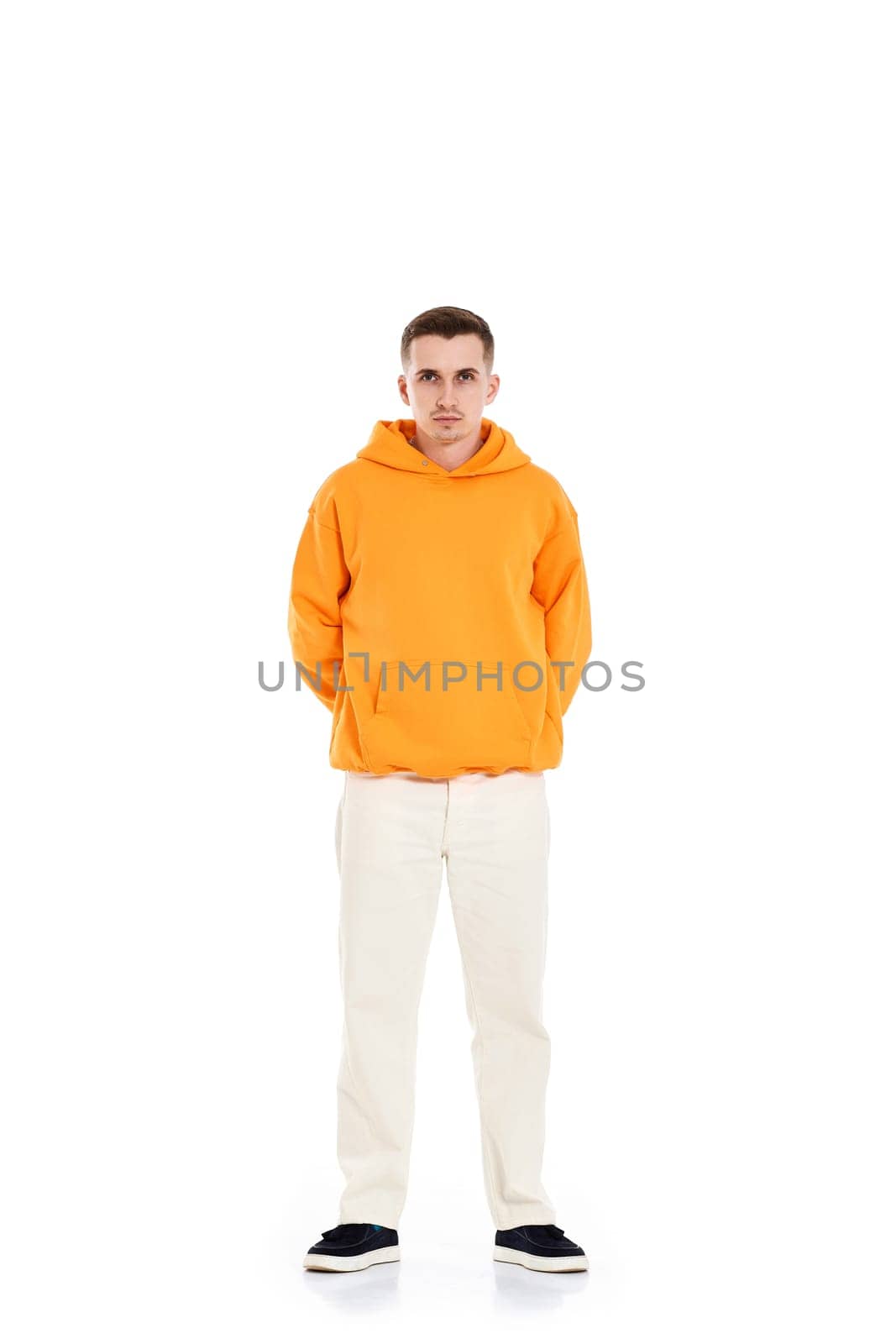 thoughtful young man in blank sweatshirt with space for your logo or design on white background. . Full length