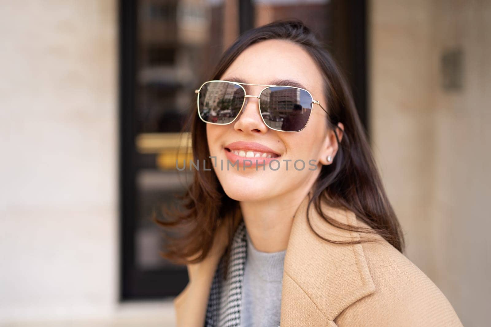 Portrait smiling middle age woman in sunglasses by andreonegin
