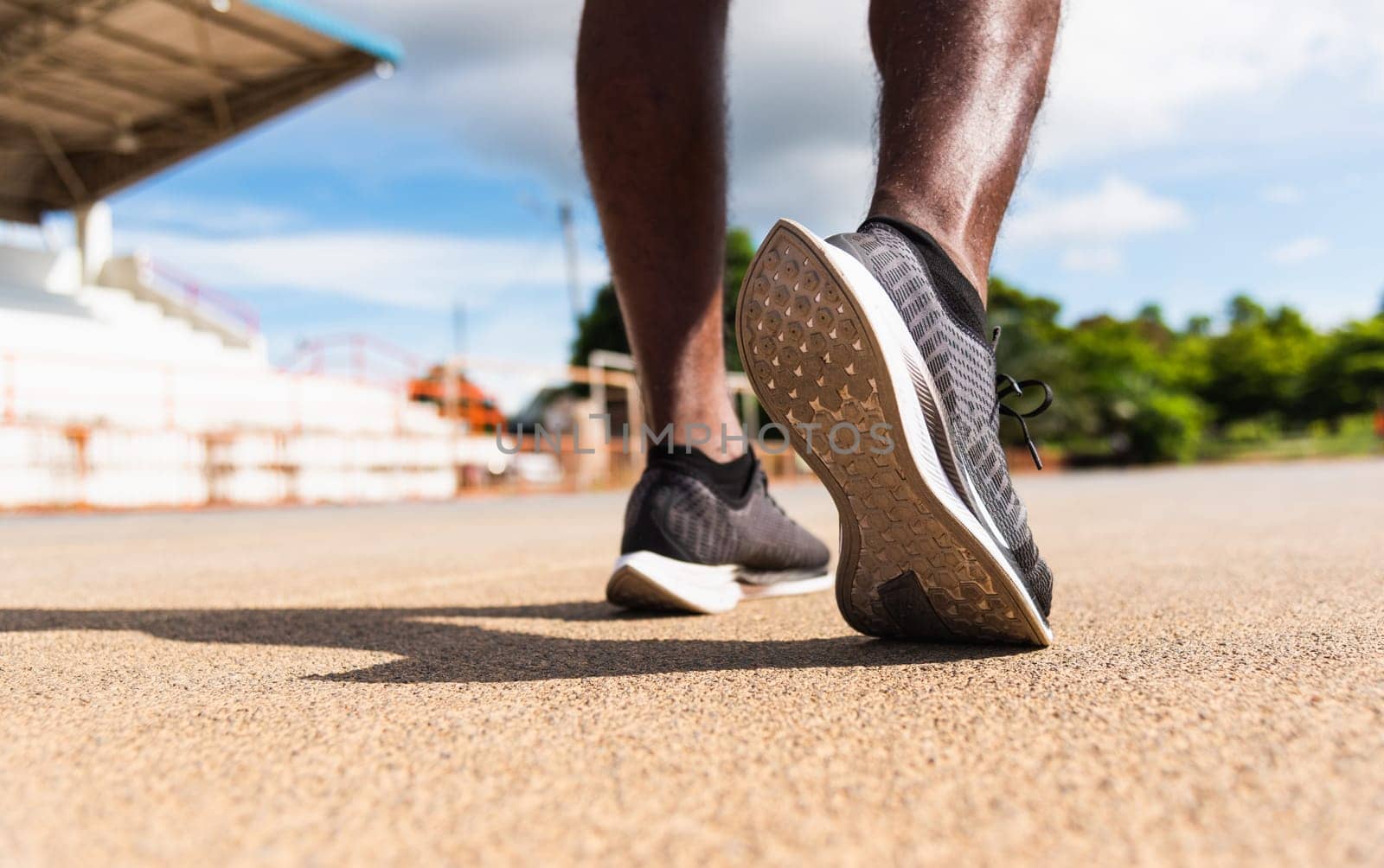 sport runner black man wear feet active ready to running training by Sorapop