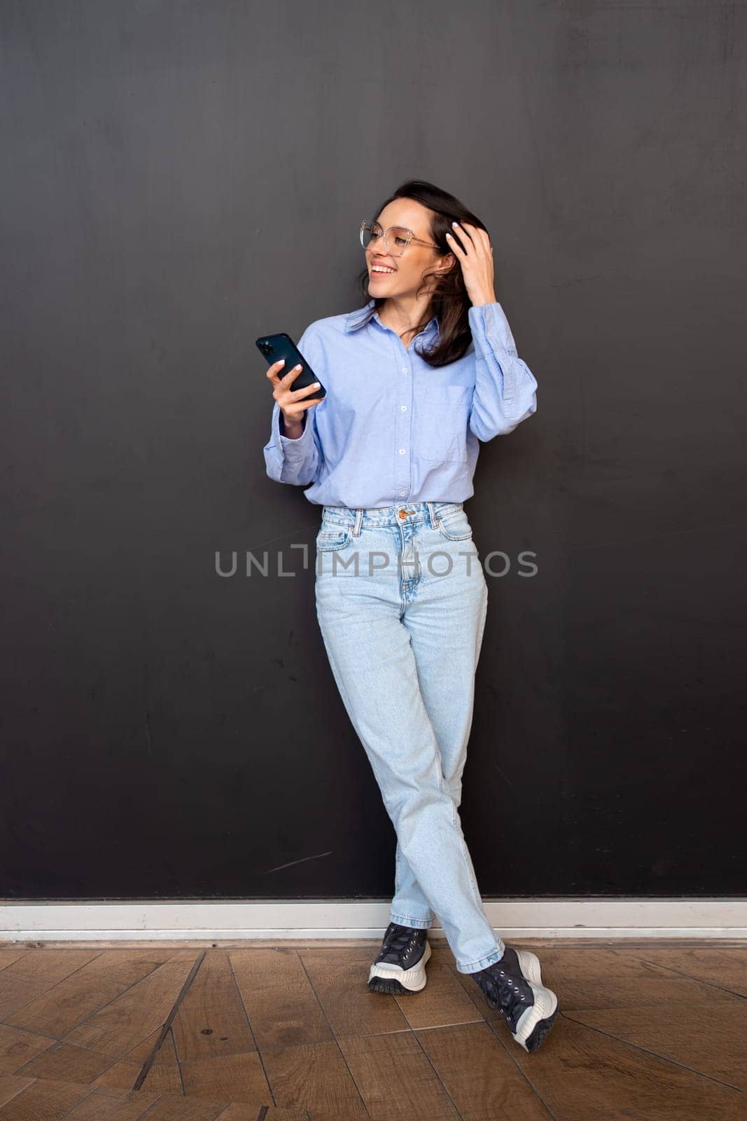 Woman use smartphone Full length by andreonegin