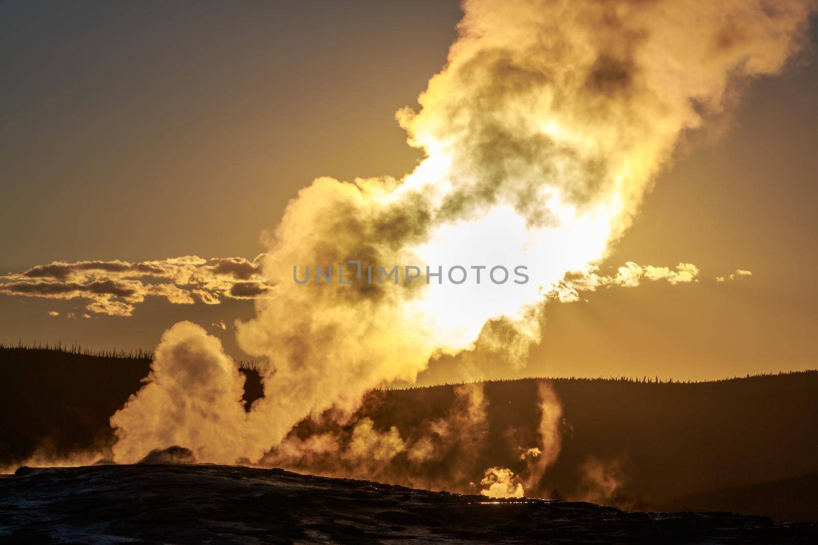 Sunset of Old Faithful in Yellowstone National Park
