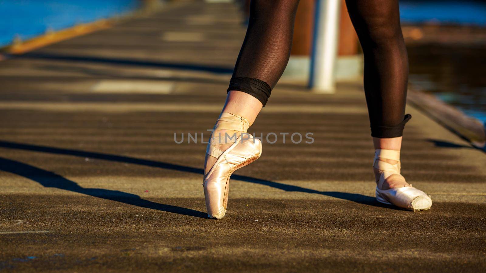 Young female ballet dancer practices at waterfront, Portland downtown.