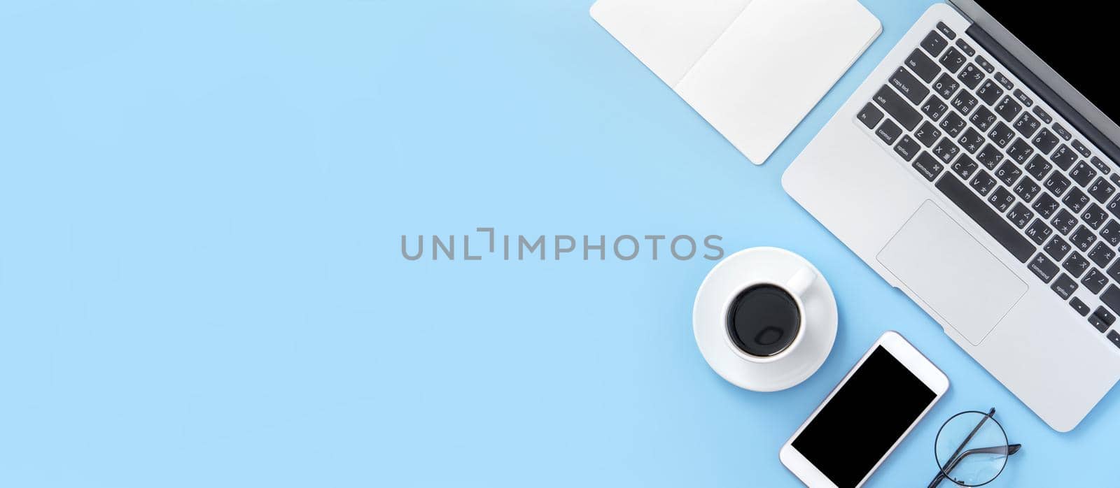 Business concept, relaxation in working time, drinking coffee taking a break on clean light blue office table, copy space, flat lay, top view, mockup by ROMIXIMAGE