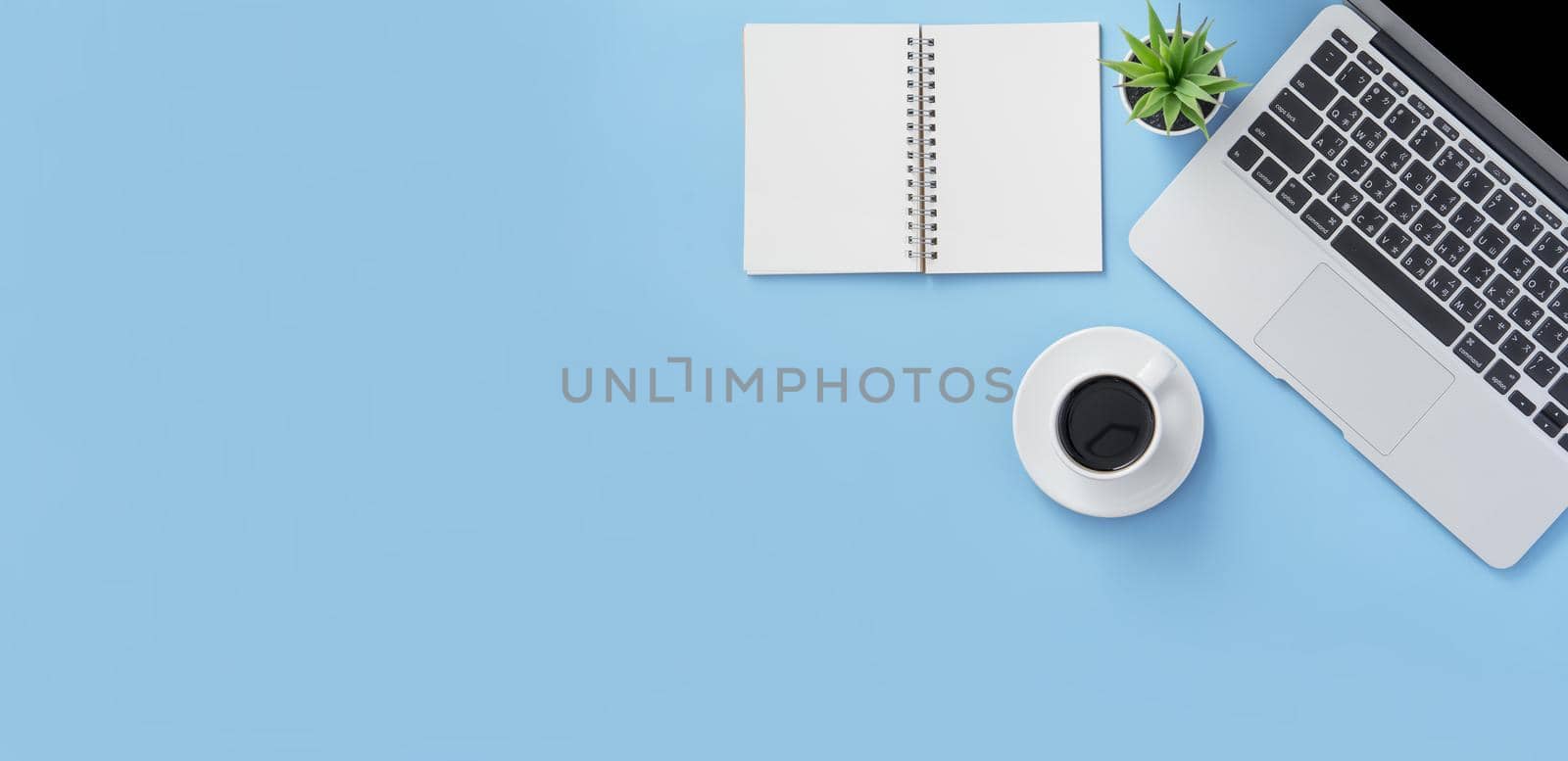 Business concept, relaxation in working time, drinking coffee taking a break on clean light blue office table, copy space, flat lay, top view, mockup by ROMIXIMAGE