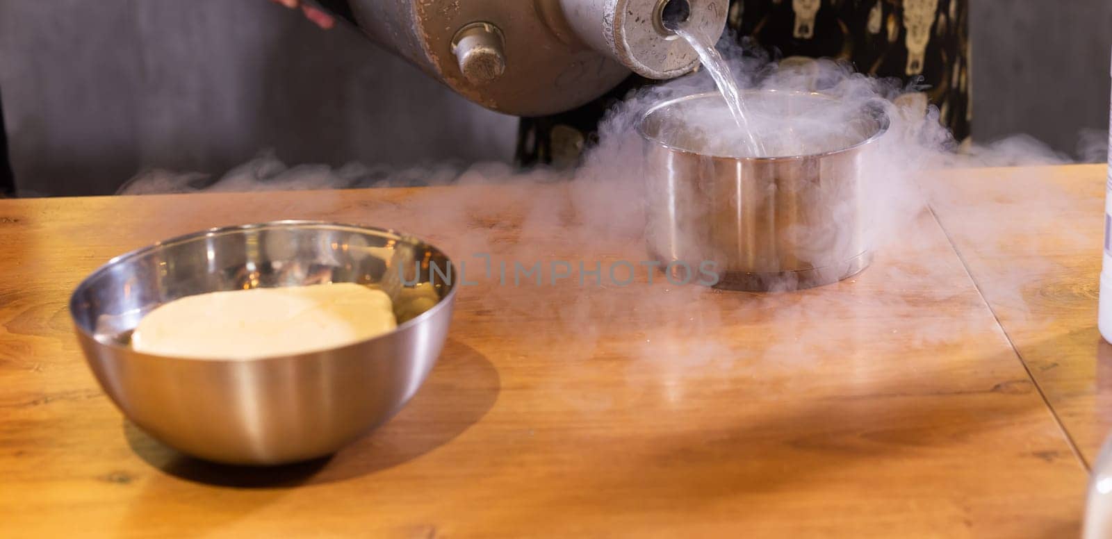 Smoke vapor dry ice in bowl in kitchen copy space and empty space for text by Satura86