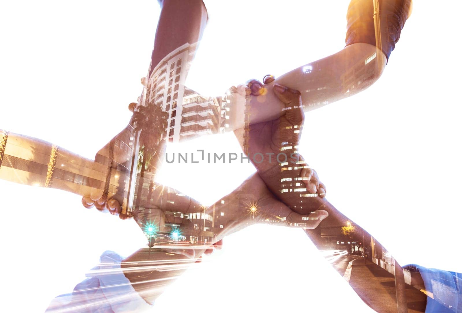 Holding hands, teamwork and diversity with building double exposure for global collaboration, architecture growth and community success. Low angle, men and women with abstract city overlay in support by YuriArcurs