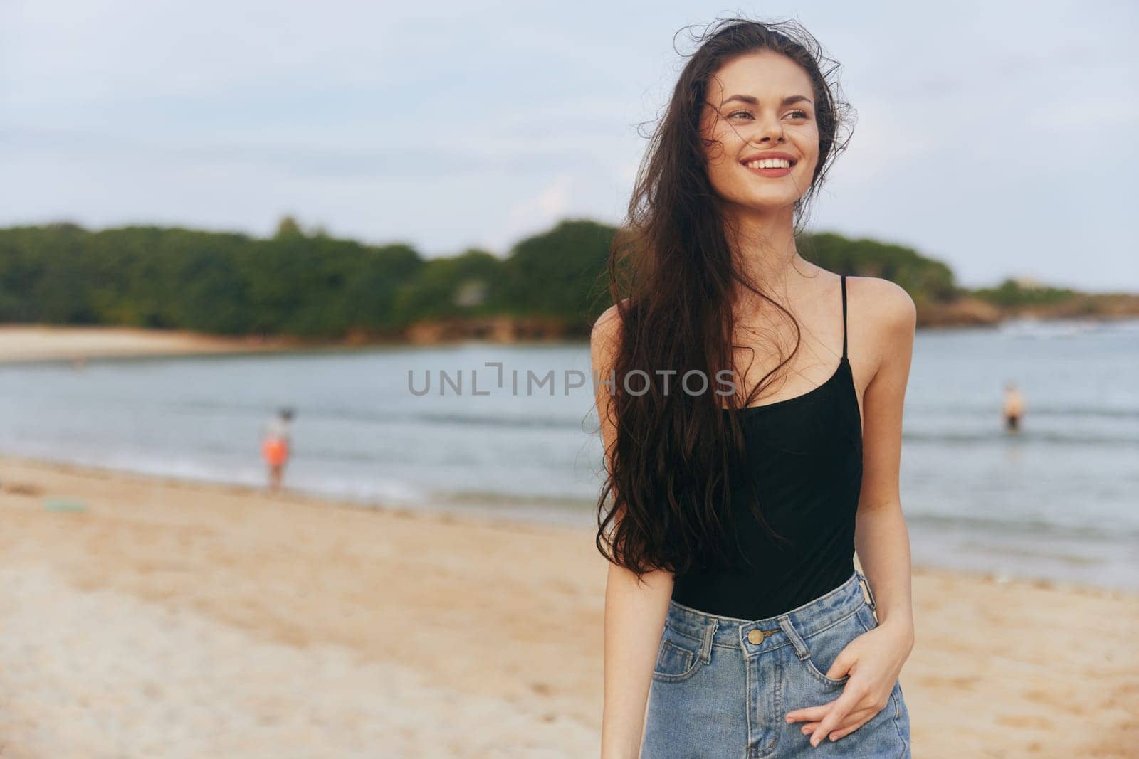 female woman sunlight ocean peaceful sky beach shore adult smile holiday lifestyle summer walking sea sand walk sunset nature vacation freedom